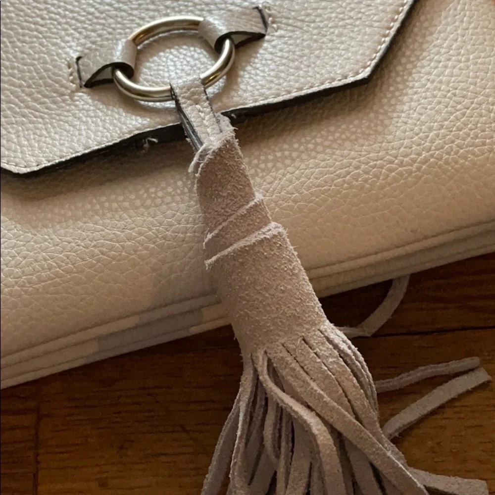 White vegan leather crossbody purse with tassel